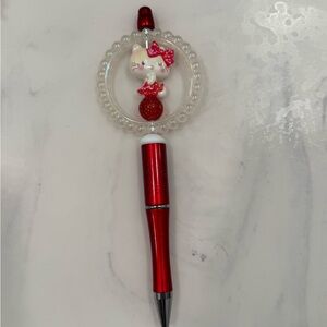 Red and White Cat-Themed Pen